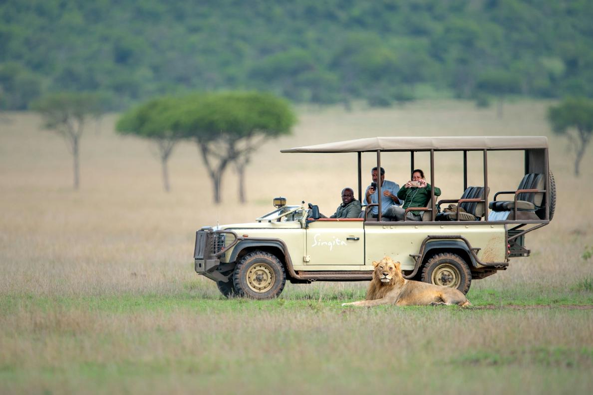 Couple on safari game drive