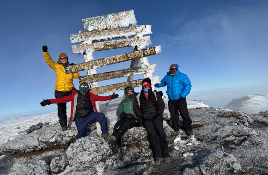 Kilimanjaro Summit Night Tips & Ascent Guide | Climb Kilimanjaro with Boko Explorers 3 Climbers celebrating at Kilimanjaro summit sign