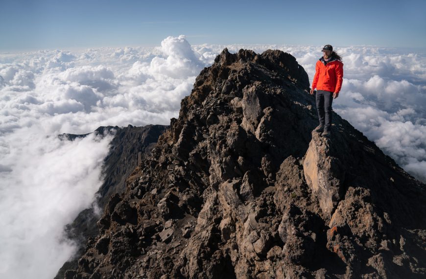 Why Climb Mount Meru Before Mount Kilimanjaro | Best Acclimatization Trek Guide 2 Hikers ascending steep ridge on Mount Meru